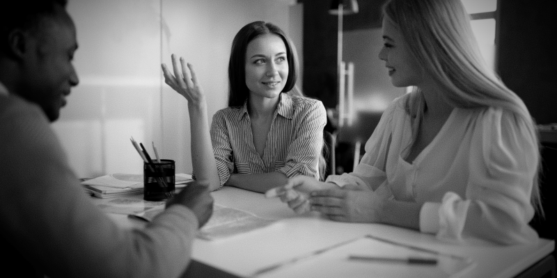 close-up-women-discussing-with-travel-agent